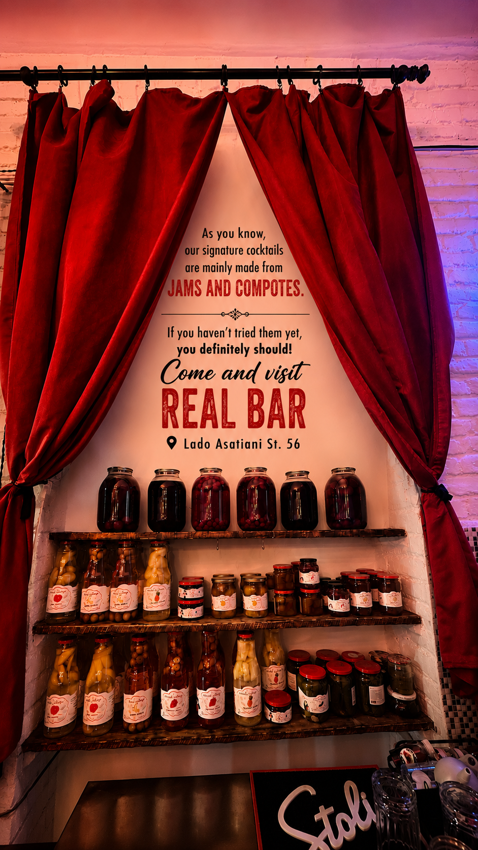 Real Bar's jar display — Georgian jams and compotes behind red velvet curtains